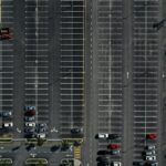 Cars parked in marked bays in a commercial car park